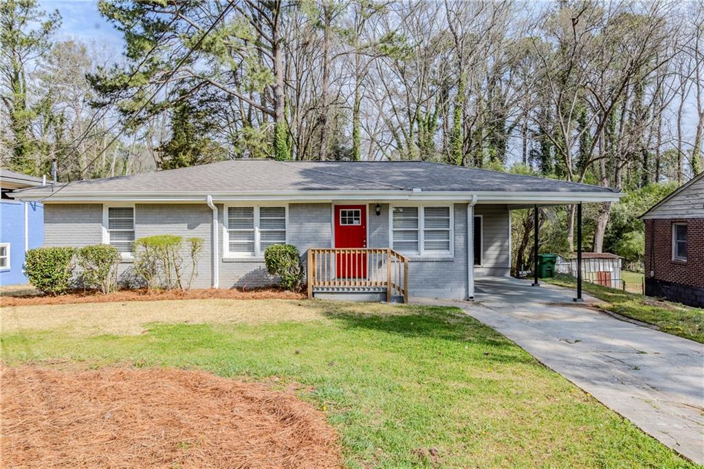 3164 Robin Road Decatur, GA 30032 - Photo 1 of 1 a front view of a house with a garden and porch