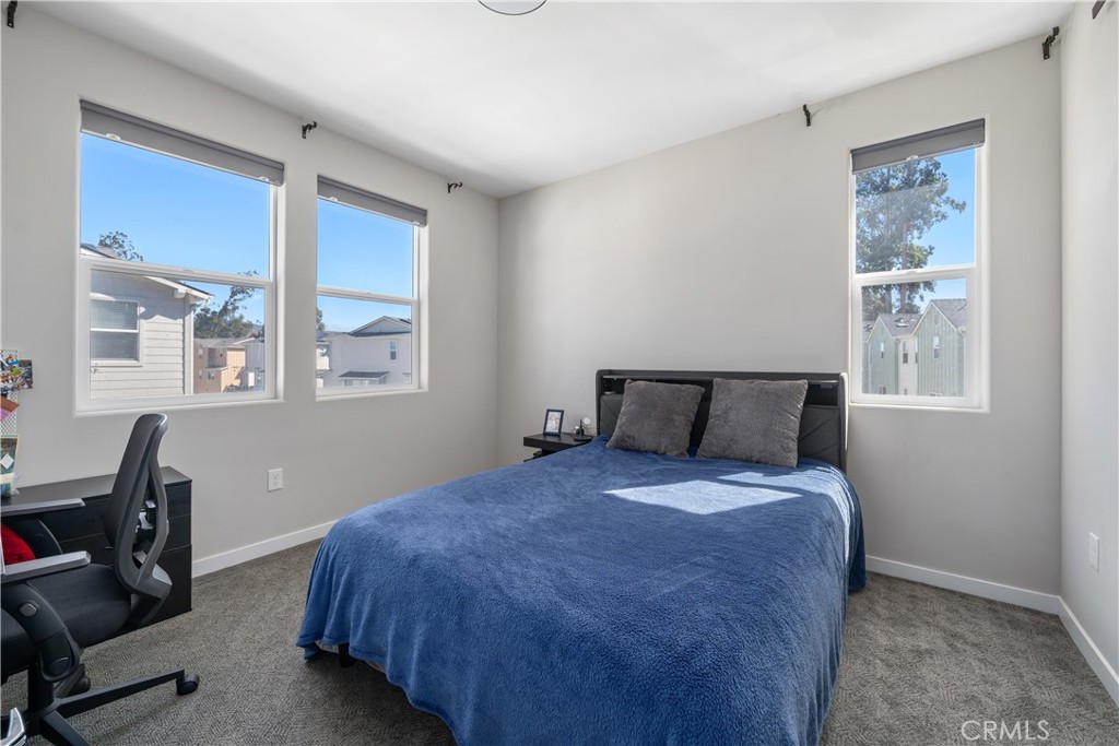 905 Madonna Road, Unit 69 San Luis Obispo, CA 93405 - Photo 11 of 26 a bedroom with a bed and a window