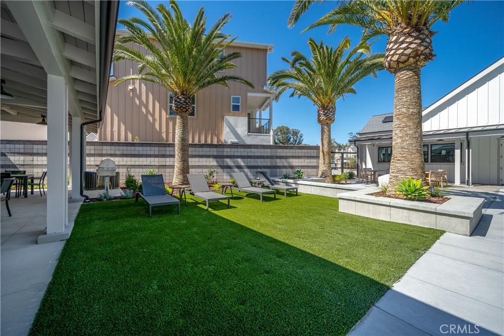 905 Madonna Road, Unit 69 San Luis Obispo, CA 93405 - Photo 23 of 26 a view of a house with a yard and potted plants