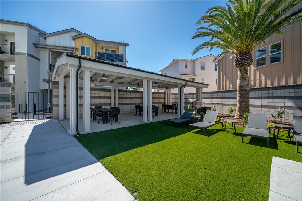905 Madonna Road, Unit 69 San Luis Obispo, CA 93405 - Photo 24 of 26 a view of a house with backyard porch and sitting area