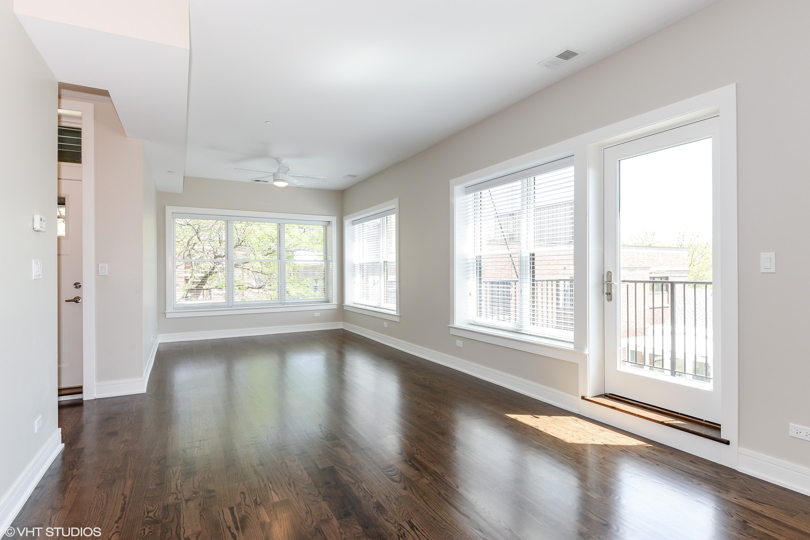 493 Sheridan Road, Unit 402 Evanston, IL 60202 - Photo 2 of 9 a view of an empty room with wooden floor and a window