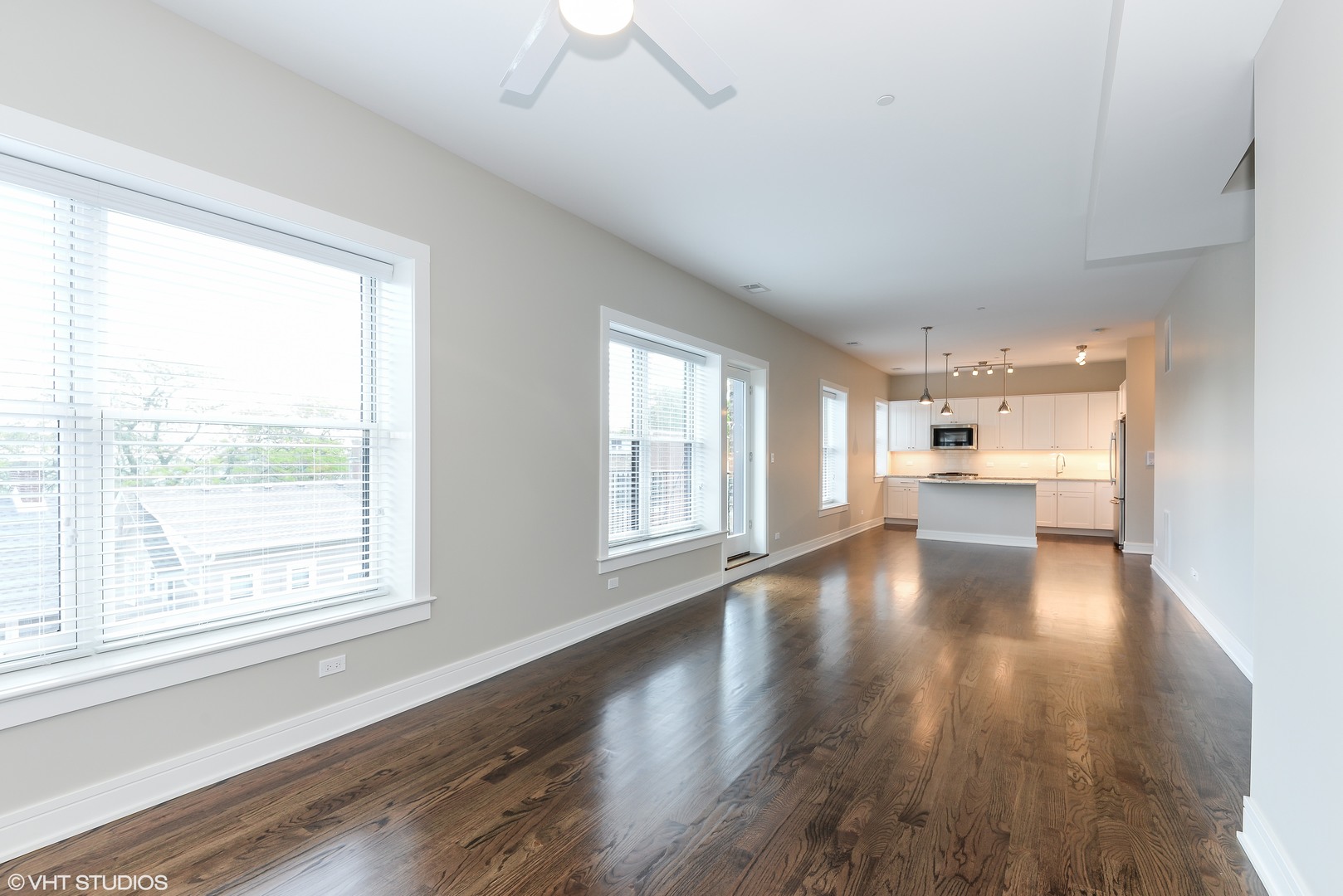 493 Sheridan Road, Unit 402 Evanston, IL 60202 - Photo 3 of 9 a view of an empty room with wooden floor and a window