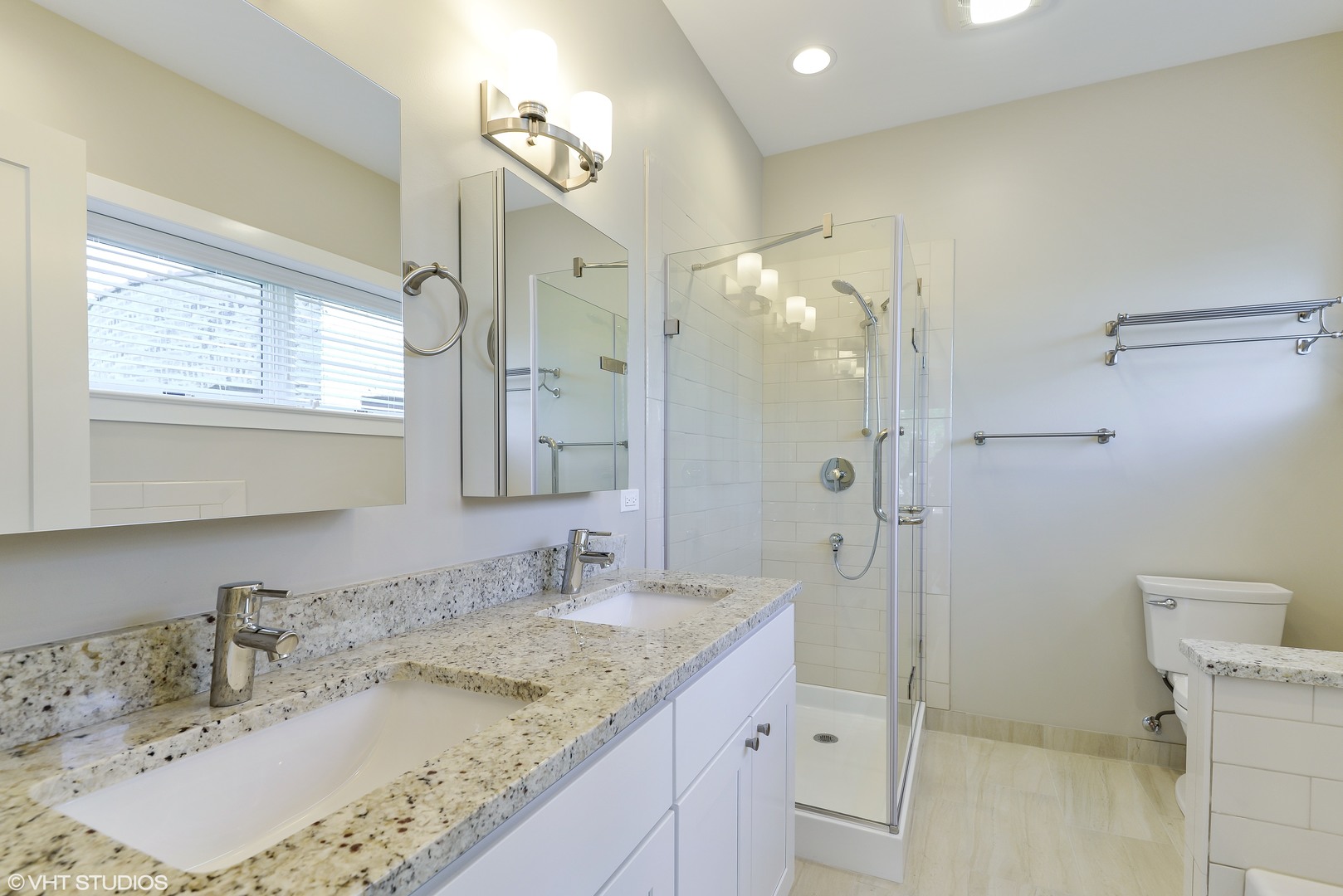 493 Sheridan Road, Unit 402 Evanston, IL 60202 - Photo 5 of 9 a bathroom with a granite countertop sink a mirror and a shower
