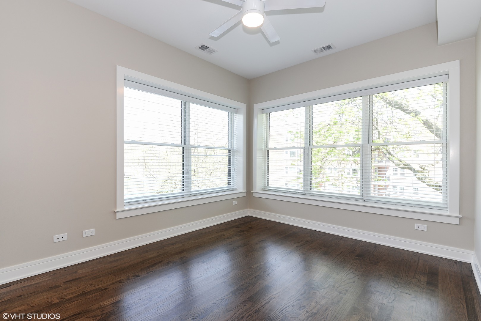 493 Sheridan Road, Unit 402 Evanston, IL 60202 - Photo 6 of 9 an empty room with wooden floor and windows
