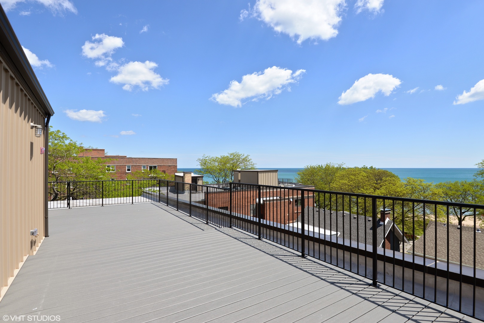 493 Sheridan Road, Unit 402 Evanston, IL 60202 - Photo 8 of 9 a view of a balcony with an ocean view