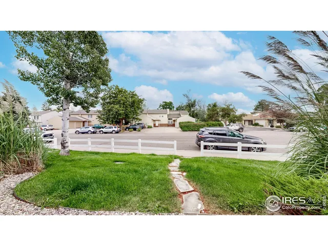 a view of a backyard with sitting area