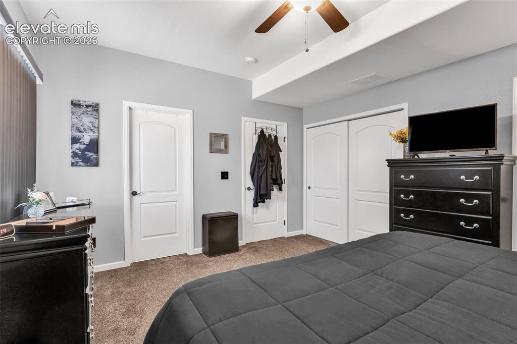 415 Empire Road Canon City, CO 81212 - Photo 21 of 40 a bedroom with a bed and a television