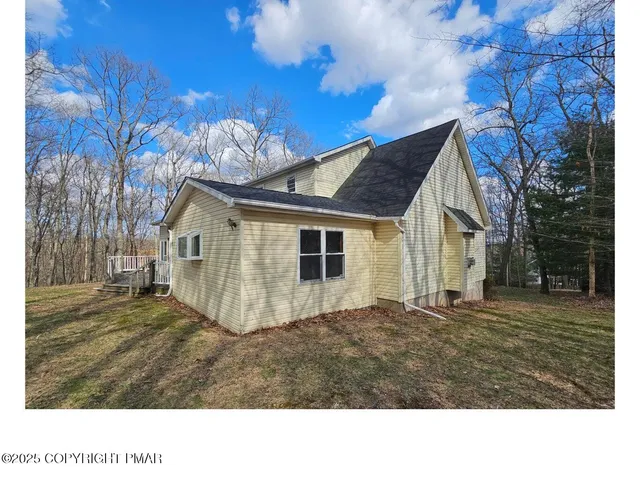 a black and white photo of a house