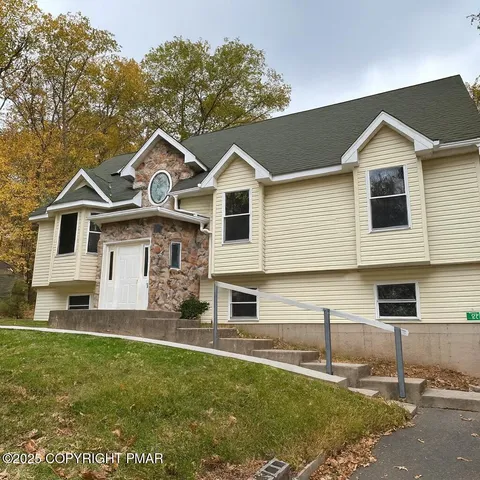 a front view of a house with a yard