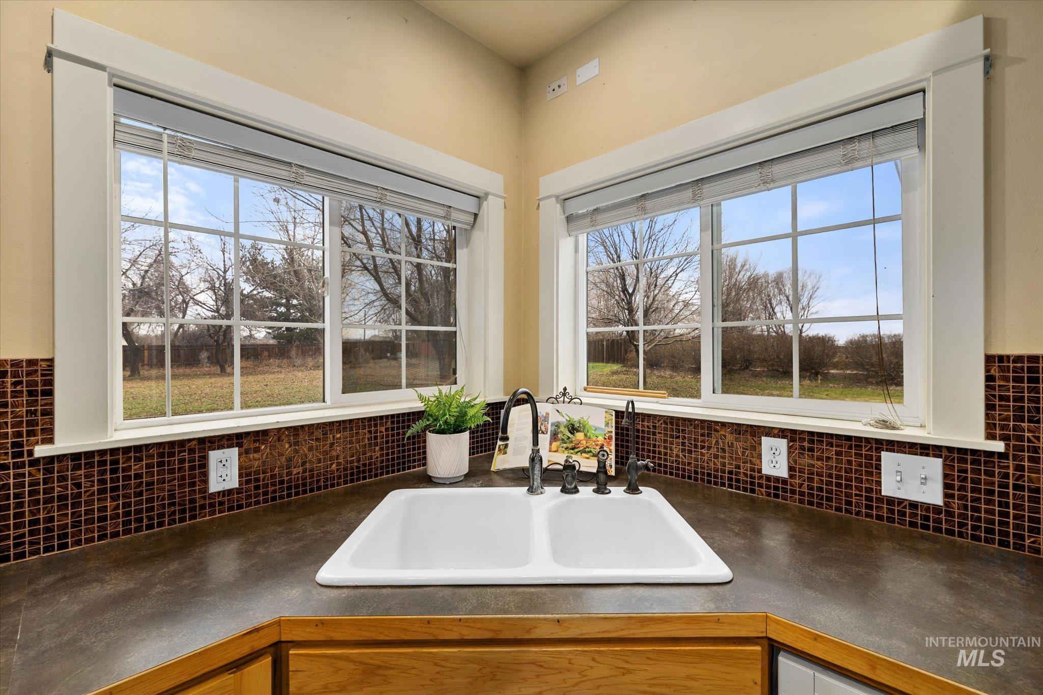 29410 Pearl Road Parma, ID 83660 - Photo 20 of 50 Kitchen featuring dark countertops and healthy amount of natural light