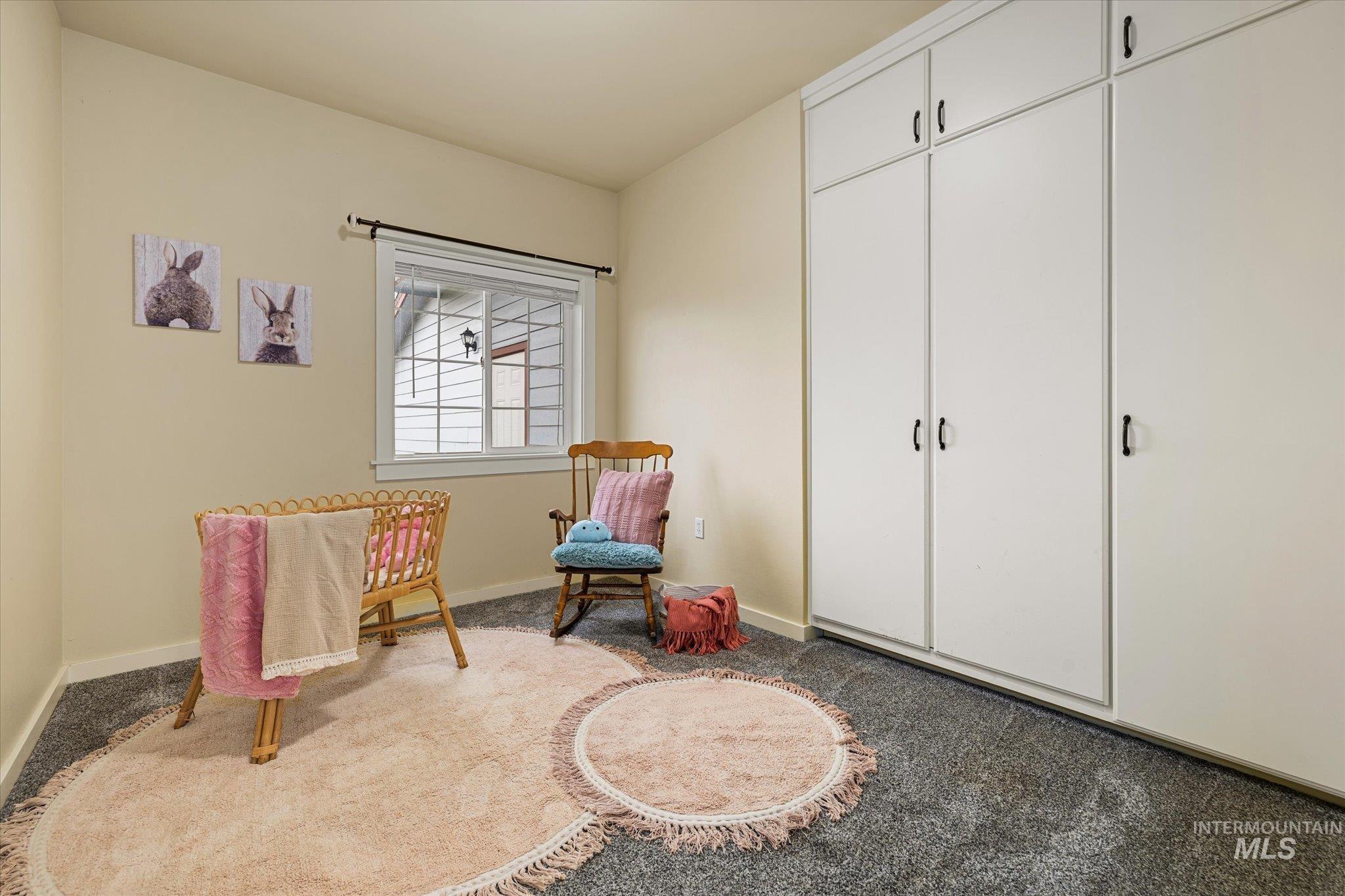 29410 Pearl Road Parma, ID 83660 - Photo 27 of 50 Living area featuring light colored carpet and baseboards