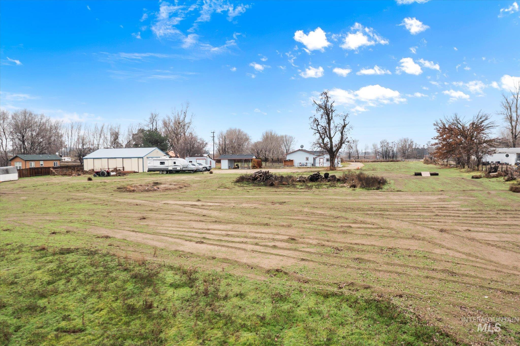 29410 Pearl Road Parma, ID 83660 - Photo 45 of 50 View of green lawn with a view of rural / pastoral area and an outdoor structure