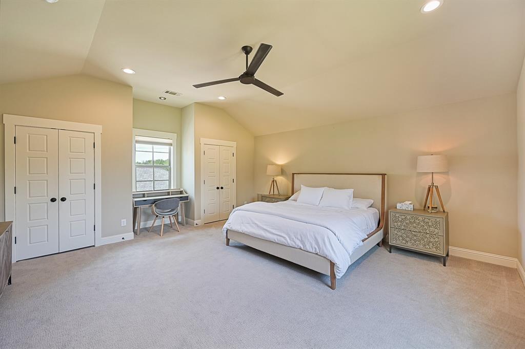 7120 Shady Grove Road Keller, TX 76248 - Photo 35 of 40 a spacious bedroom with a bed and a cabinets