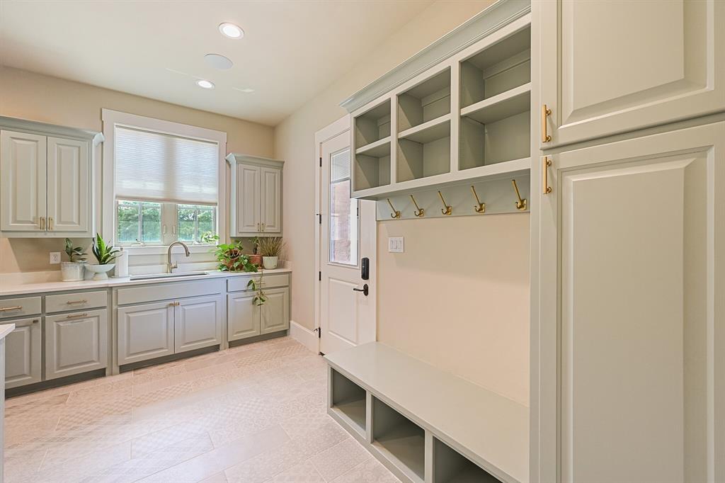 7120 Shady Grove Road Keller, TX 76248 - Photo 36 of 40 a kitchen with a refrigerator and white cabinets