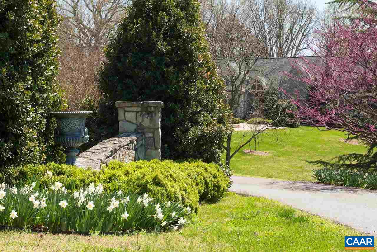 2121 Garth Road Charlottesville, VA 22901 - Photo 30 of 75 a view of a garden with a bench