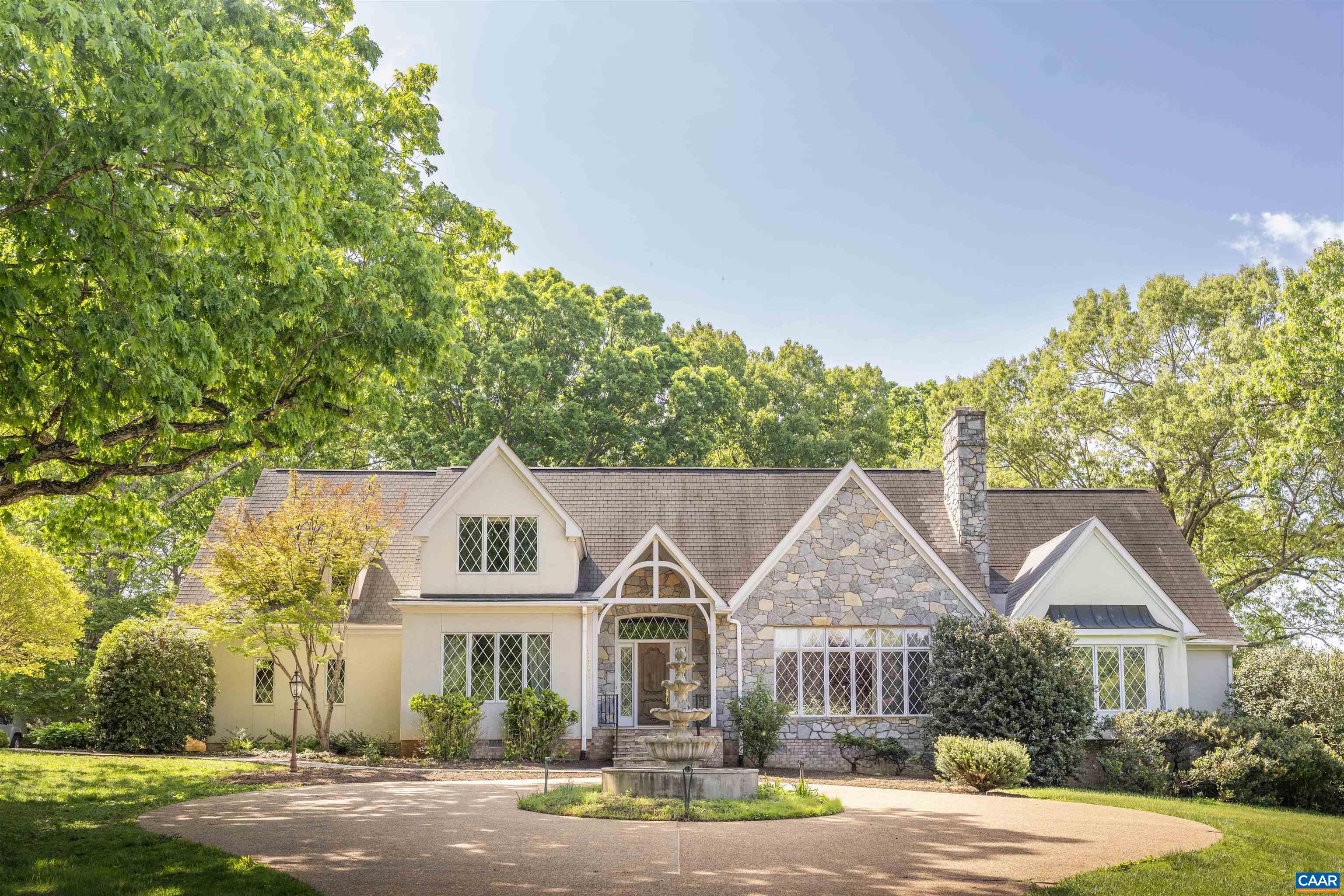 2121 Garth Road Charlottesville, VA 22901 - Photo 3 of 75 a front view of a house with a garden