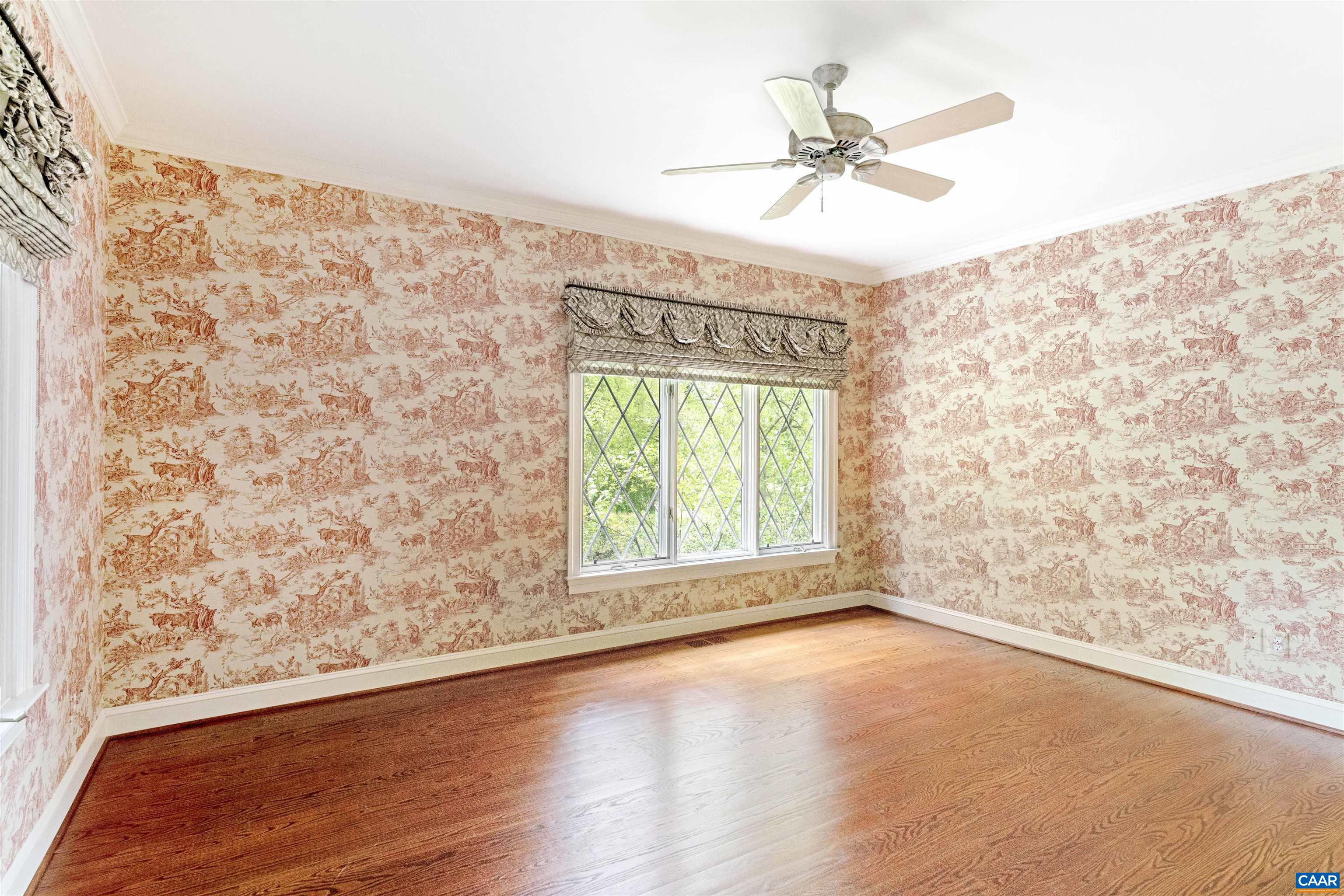 2121 Garth Road Charlottesville, VA 22901 - Photo 46 of 75 an empty room with a window and a ceiling fan