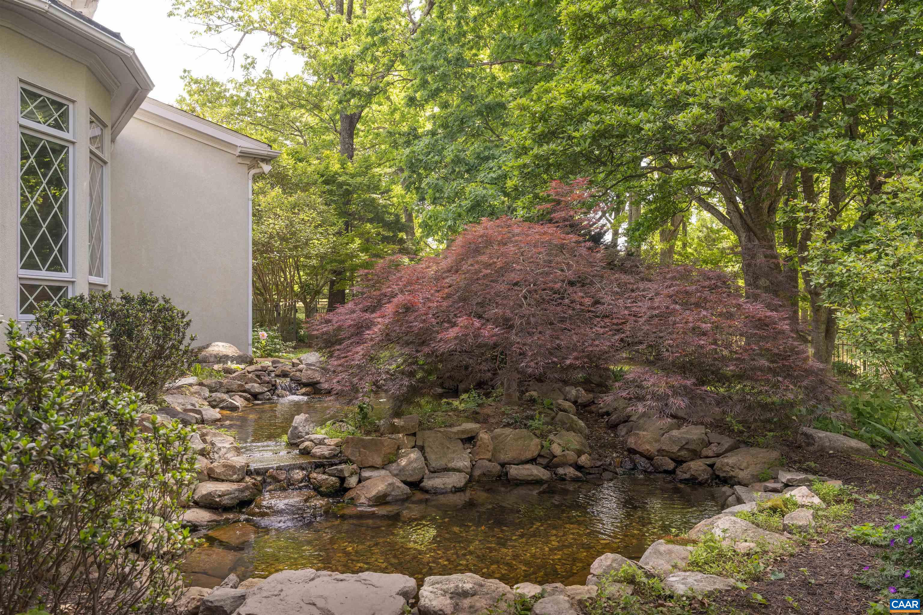 2121 Garth Road Charlottesville, VA 22901 - Photo 7 of 75 a backyard of a house with lots of green space