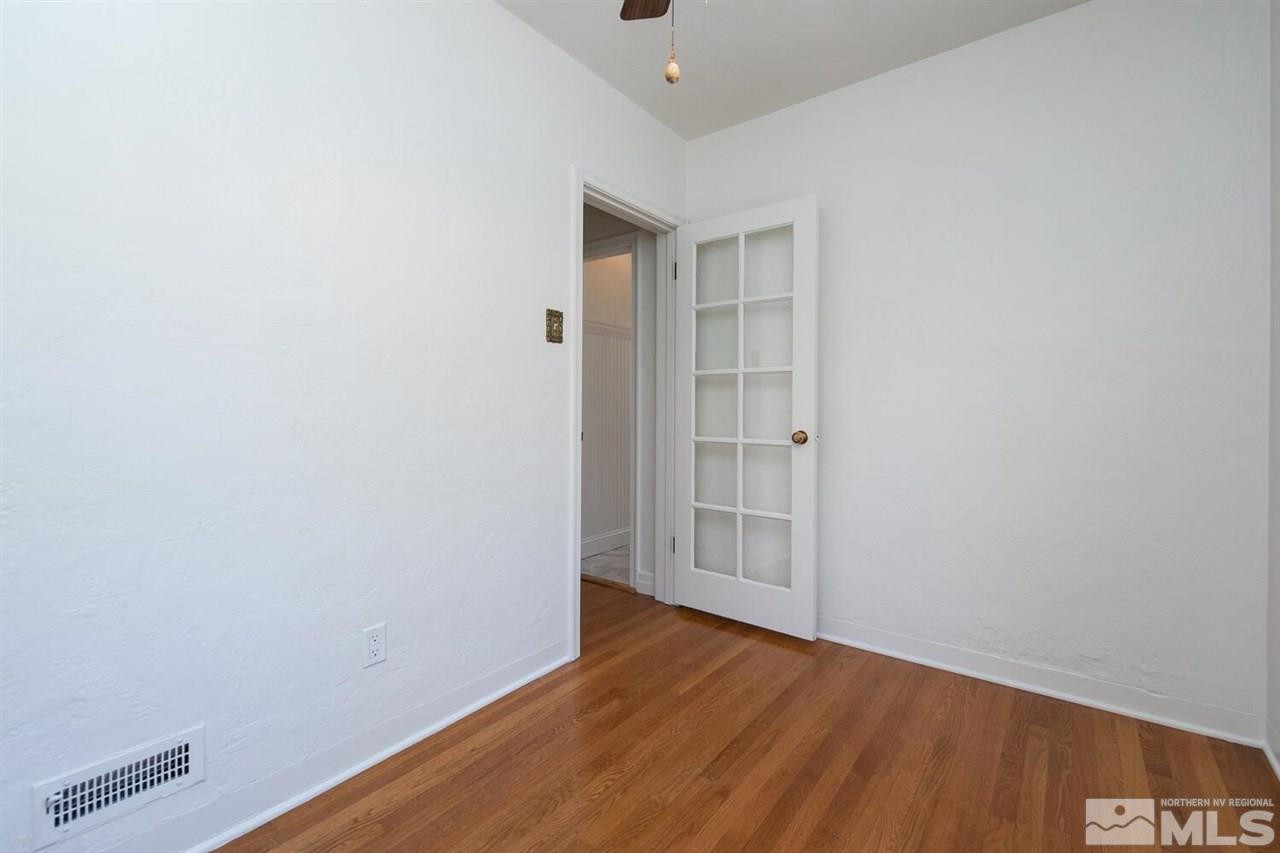 622 Manor Drive Reno, NV 89509 - Photo 11 of 25 a view of an empty room with wooden floor