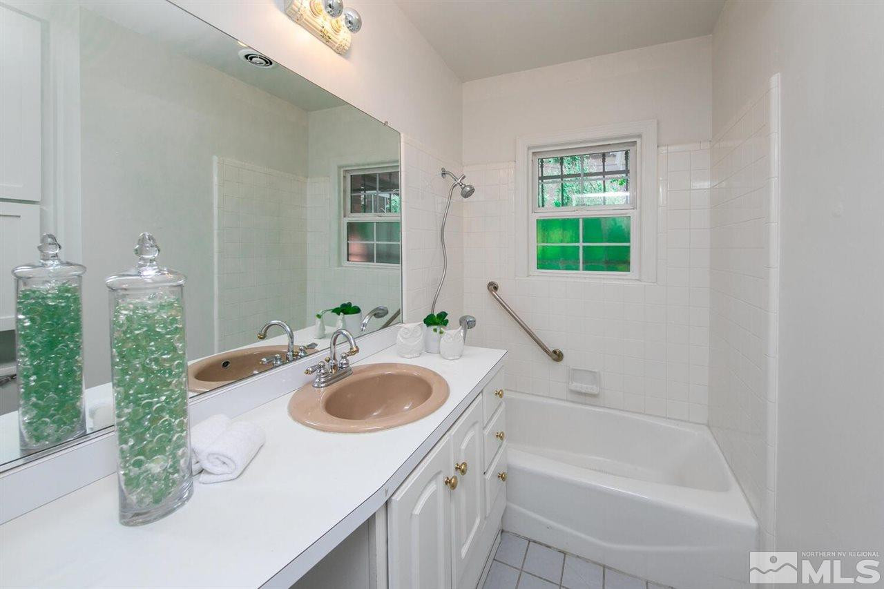 622 Manor Drive Reno, NV 89509 - Photo 12 of 25 a bathroom with a sink and a mirror