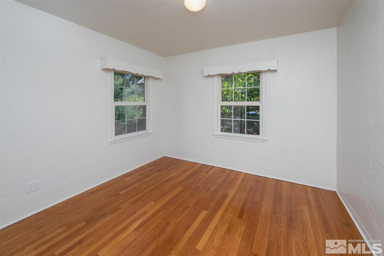 622 Manor Drive Reno, NV 89509 - Photo 13 of 25 an empty room with wooden floor and windows