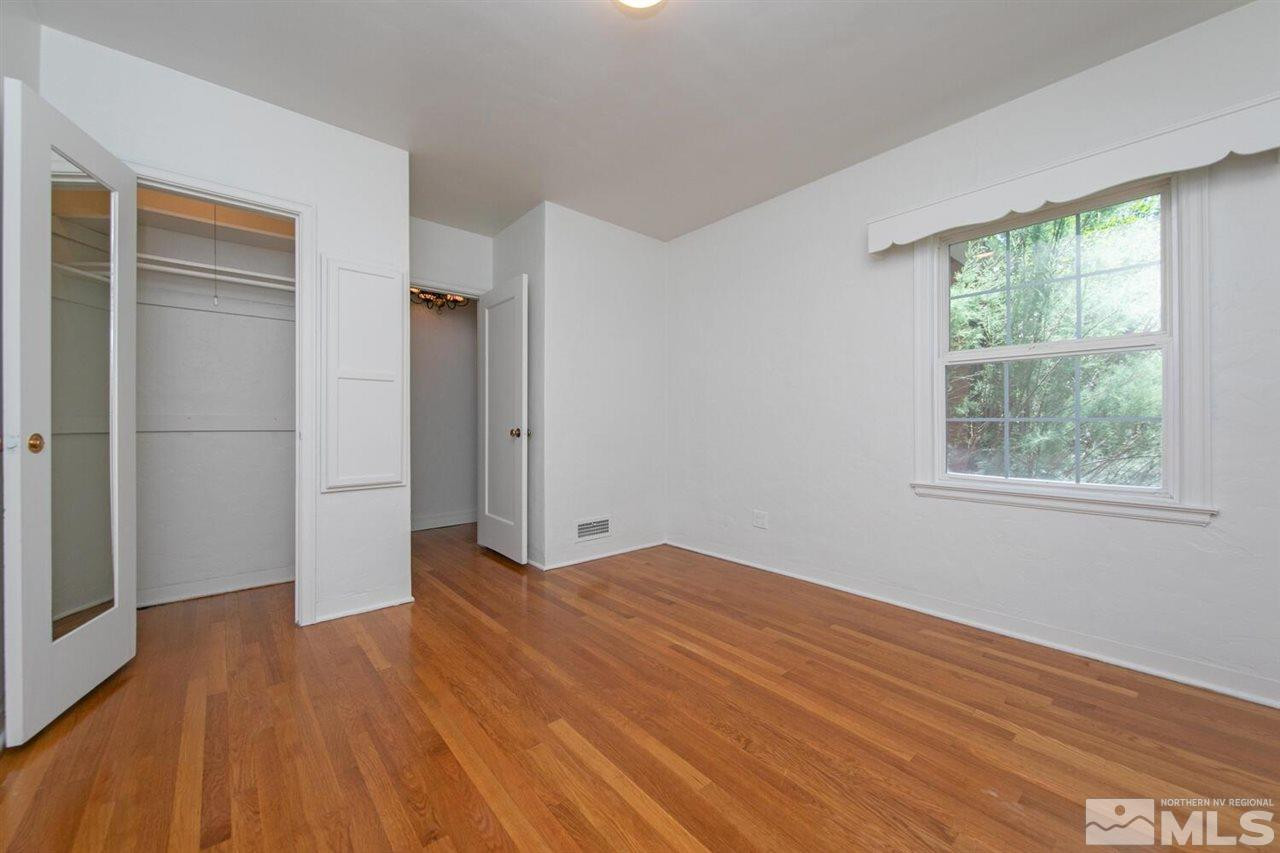 622 Manor Drive Reno, NV 89509 - Photo 14 of 25 an empty room with wooden floor and windows