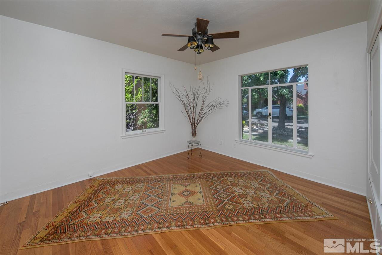 622 Manor Drive Reno, NV 89509 - Photo 15 of 25 a view of a big room with windows and chandelier fan