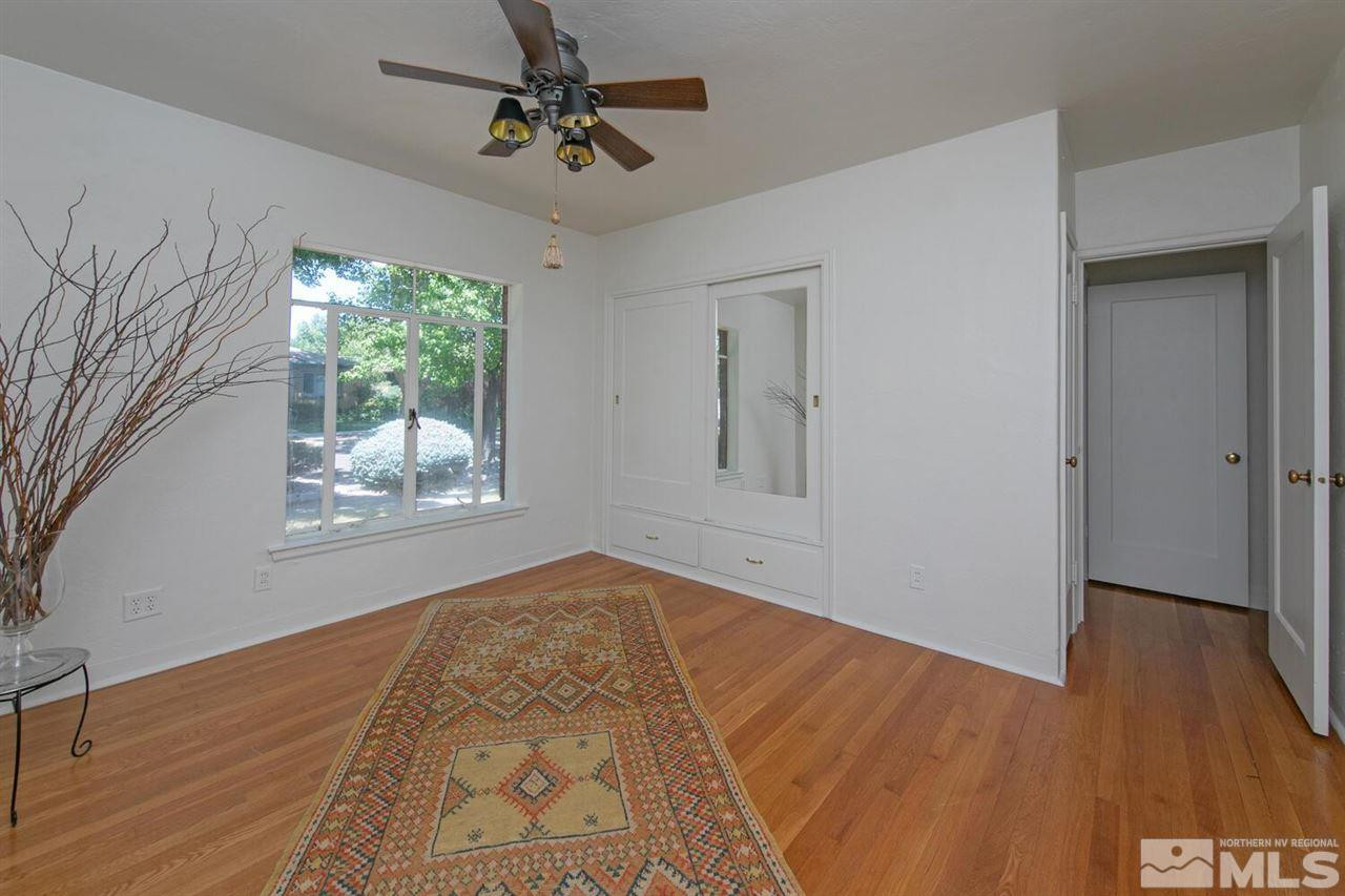 622 Manor Drive Reno, NV 89509 - Photo 16 of 25 a view of empty room with wooden floor and fan