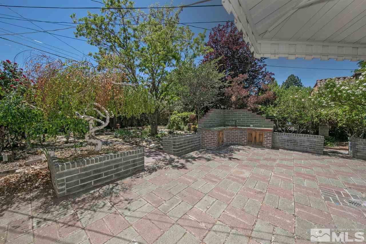 622 Manor Drive Reno, NV 89509 - Photo 22 of 25 a backyard of a house with lots of green space