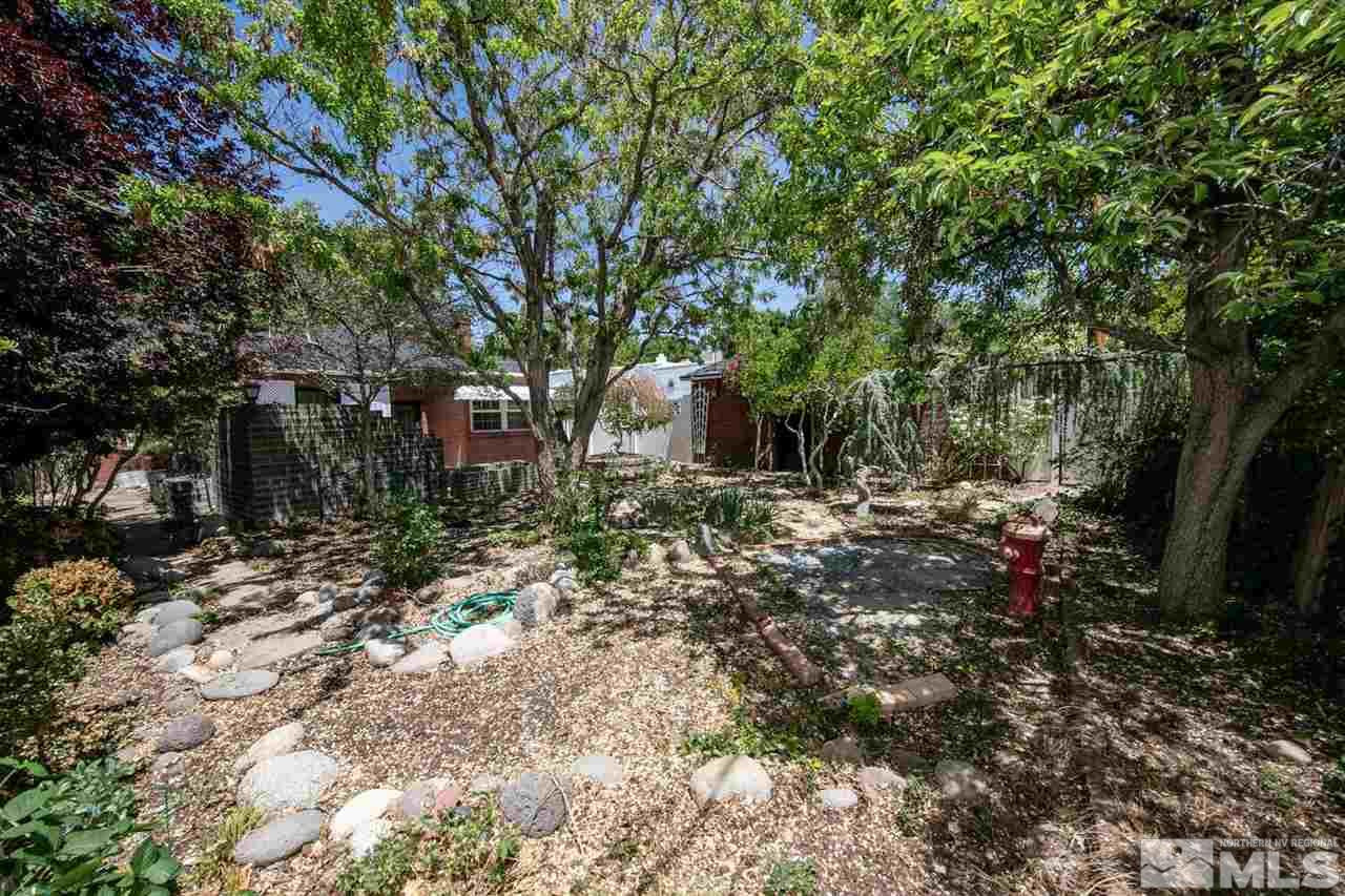 622 Manor Drive Reno, NV 89509 - Photo 23 of 25 a backyard of a house with lots of green space