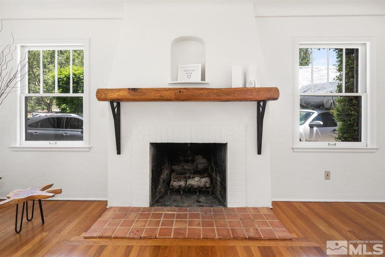 622 Manor Drive Reno, NV 89509 - Photo 3 of 25 a living room with a fireplace and windows