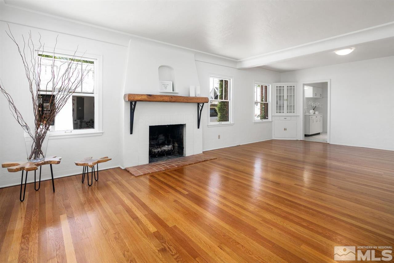 622 Manor Drive Reno, NV 89509 - Photo 4 of 25 a view of empty room with wooden floor and fireplace