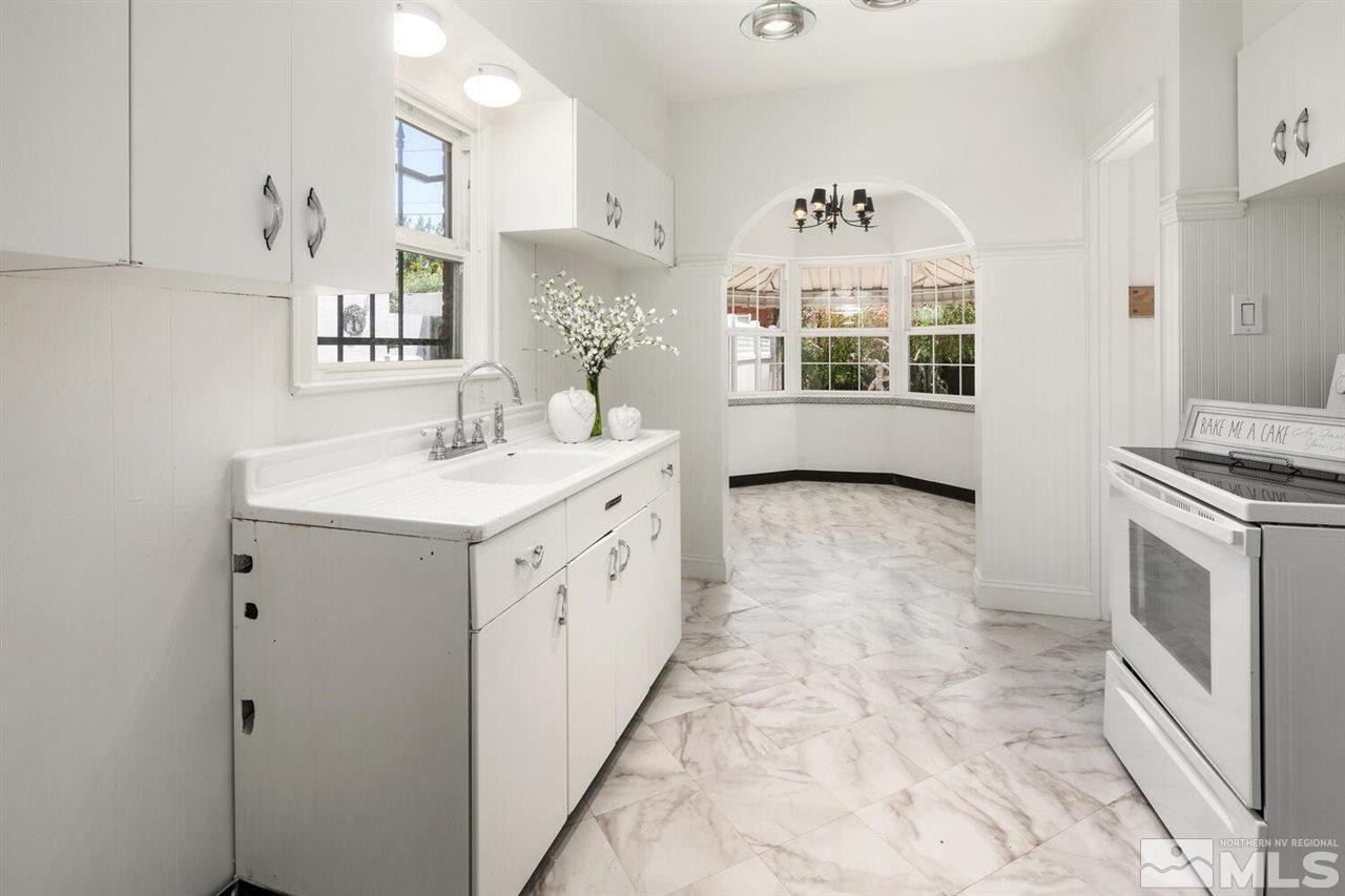 622 Manor Drive Reno, NV 89509 - Photo 6 of 25 a view of kitchen with sink microwave and cabinets