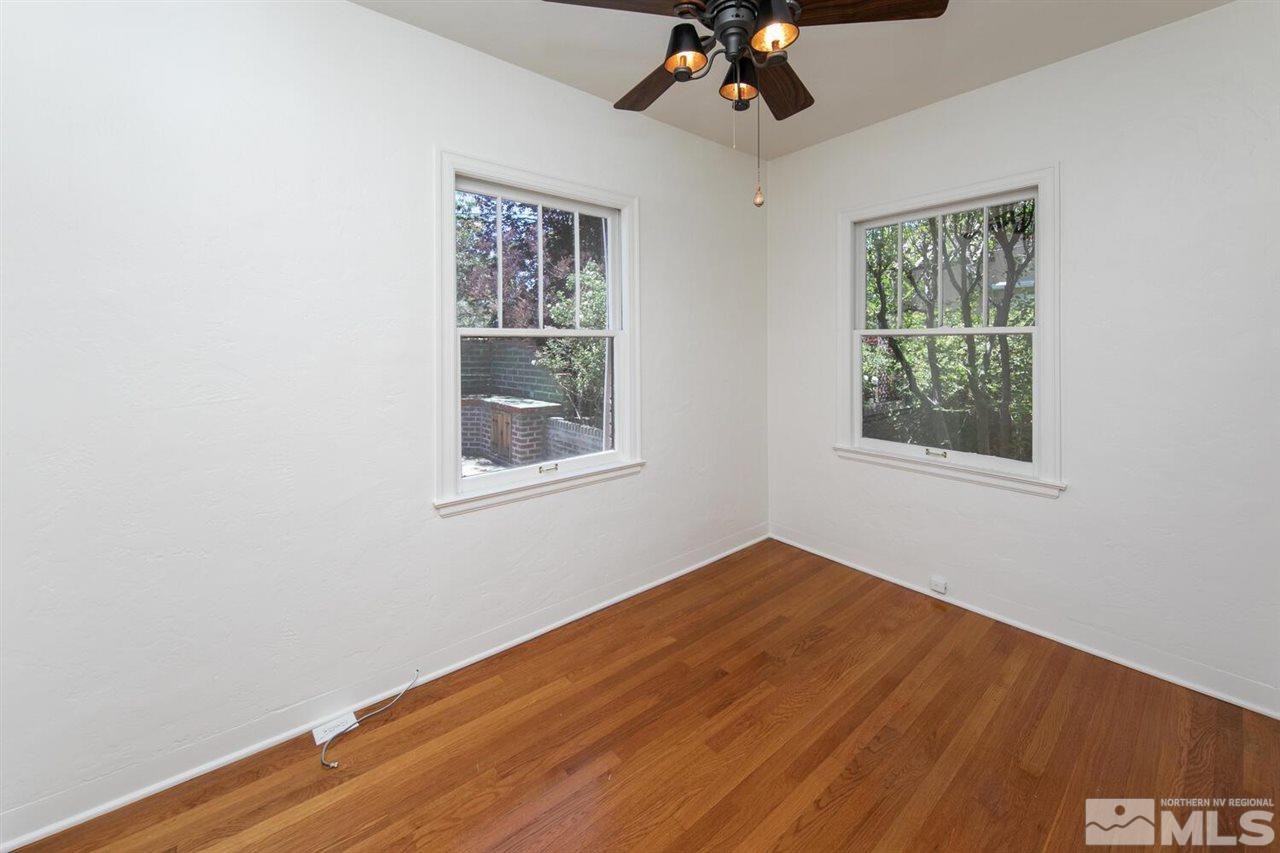 622 Manor Drive Reno, NV 89509 - Photo 10 of 25 a view of empty room with wooden floor and fan