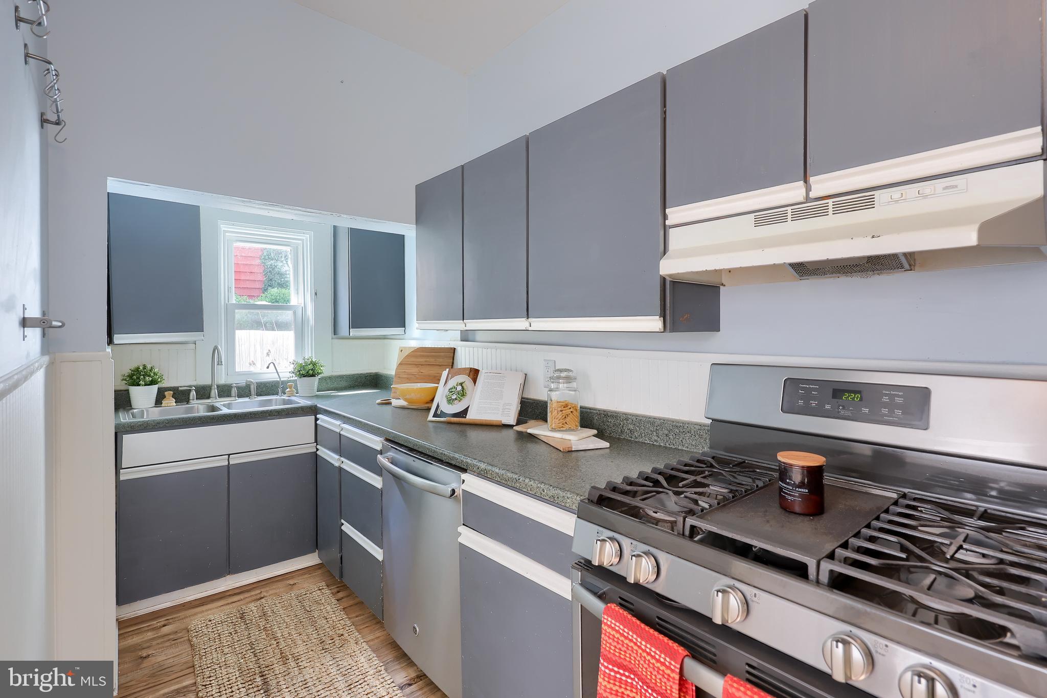 606 North Mary Street Lancaster, PA 17603 - Photo 16 of 33 a kitchen with stainless steel appliances granite countertop a stove and a sink