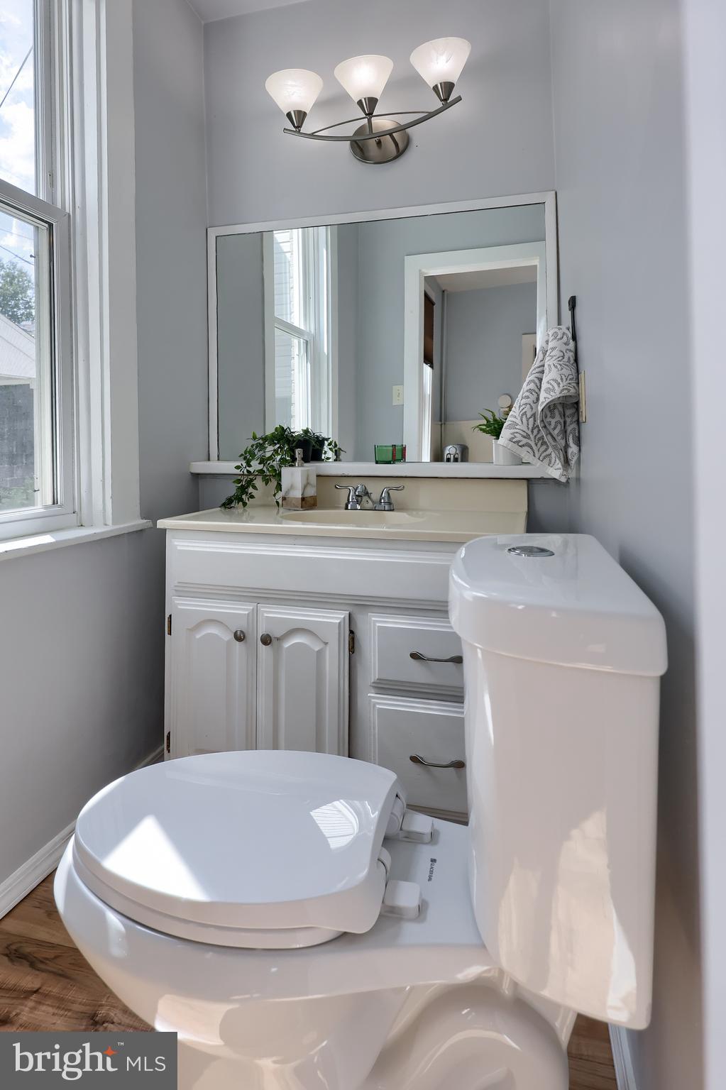 606 North Mary Street Lancaster, PA 17603 - Photo 19 of 33 a bathroom with a toilet sink and mirror