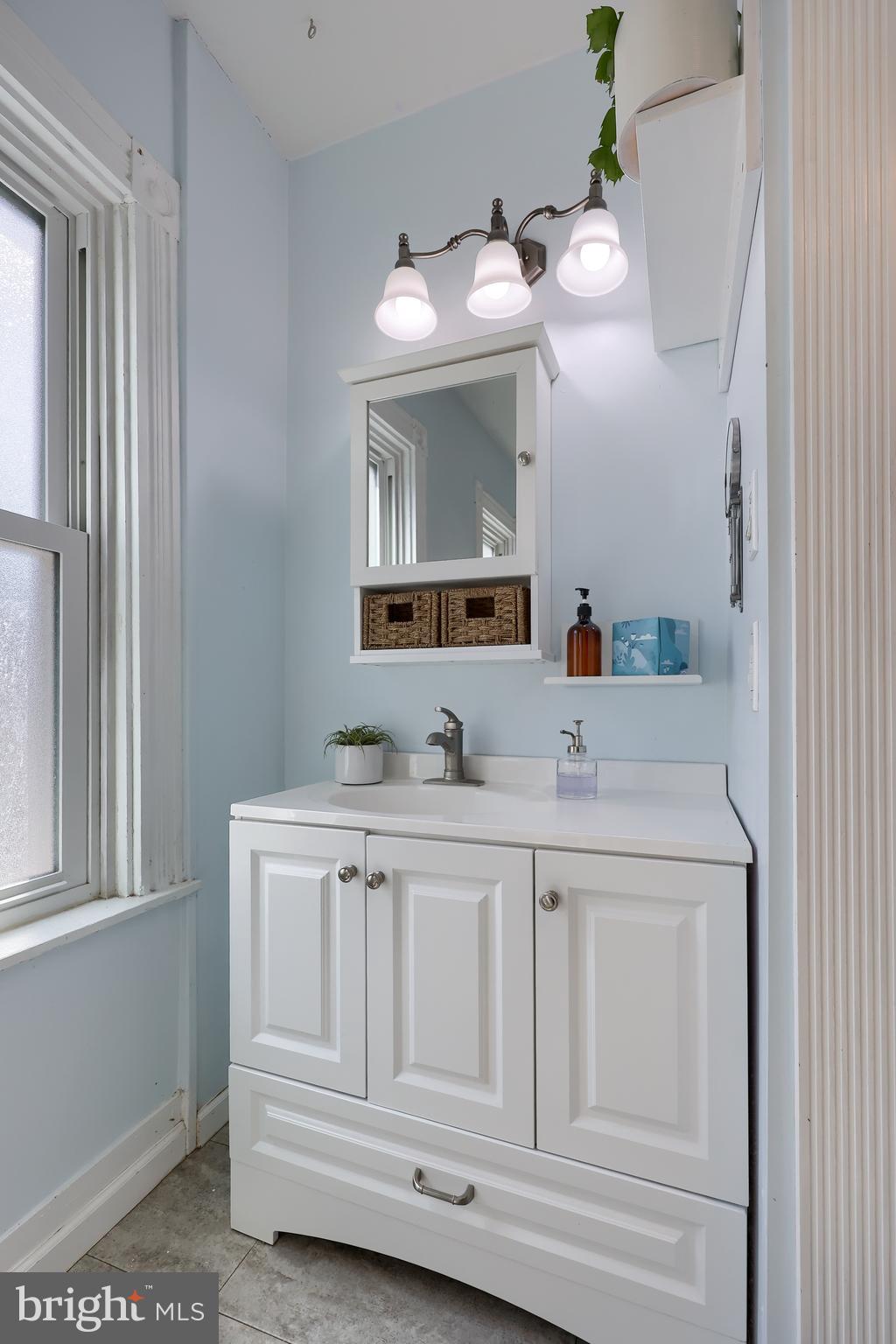 606 North Mary Street Lancaster, PA 17603 - Photo 24 of 33 a bathroom with a sink vanity and mirror