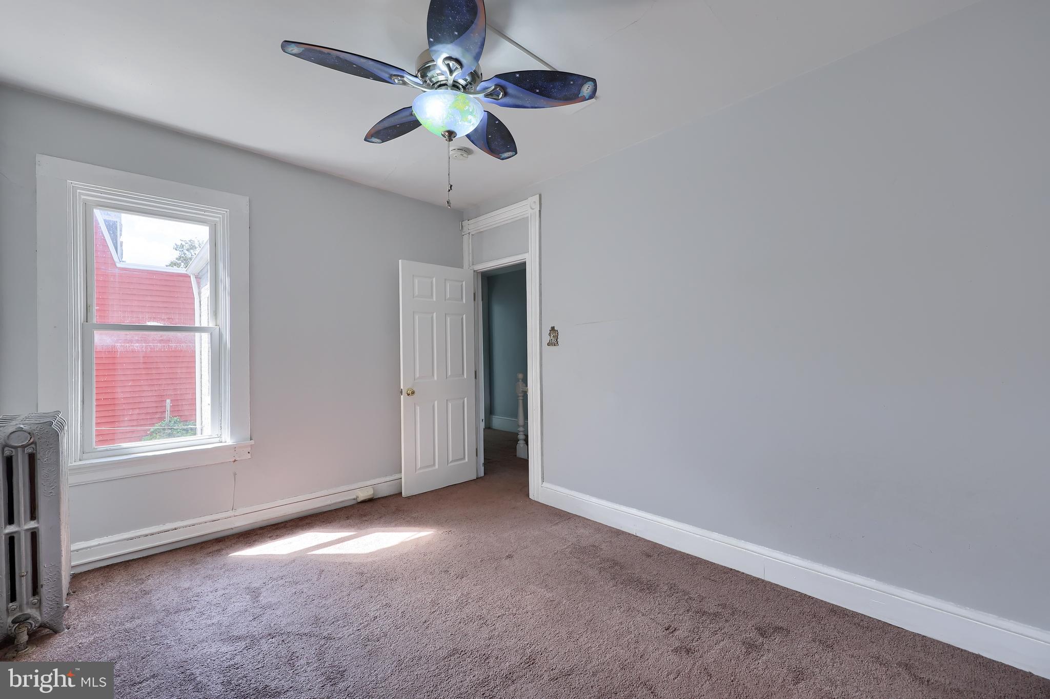 606 North Mary Street Lancaster, PA 17603 - Photo 27 of 33 an empty room with windows and fan chandelier fan