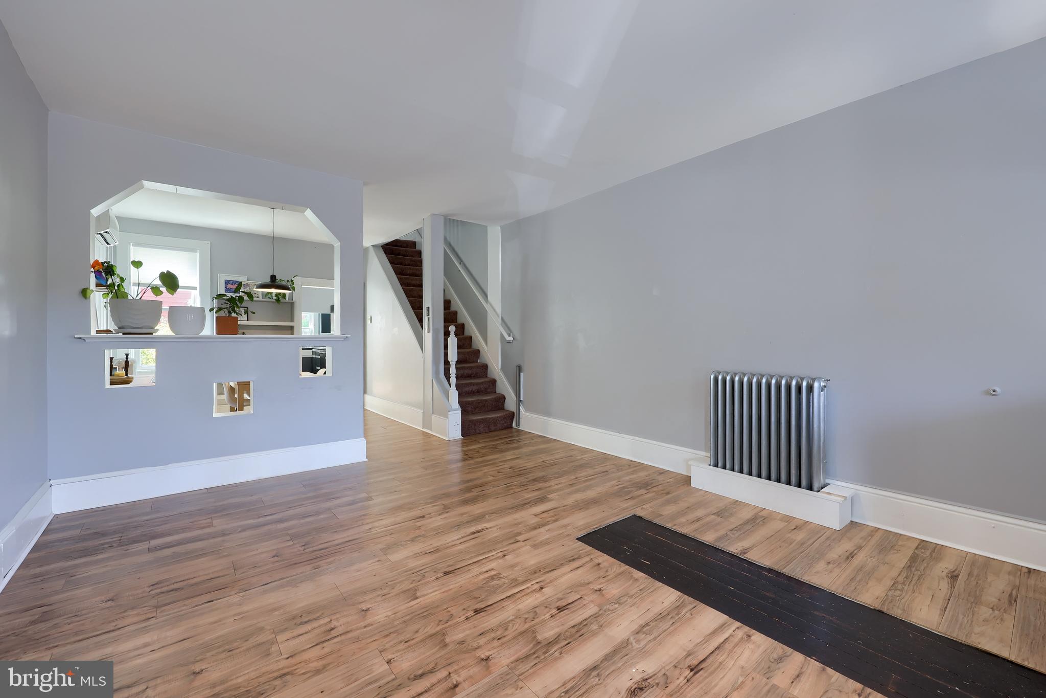 606 North Mary Street Lancaster, PA 17603 - Photo 6 of 33 a view of a hallway with wooden floor and stairs