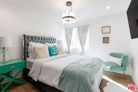 a bedroom with bed and a window