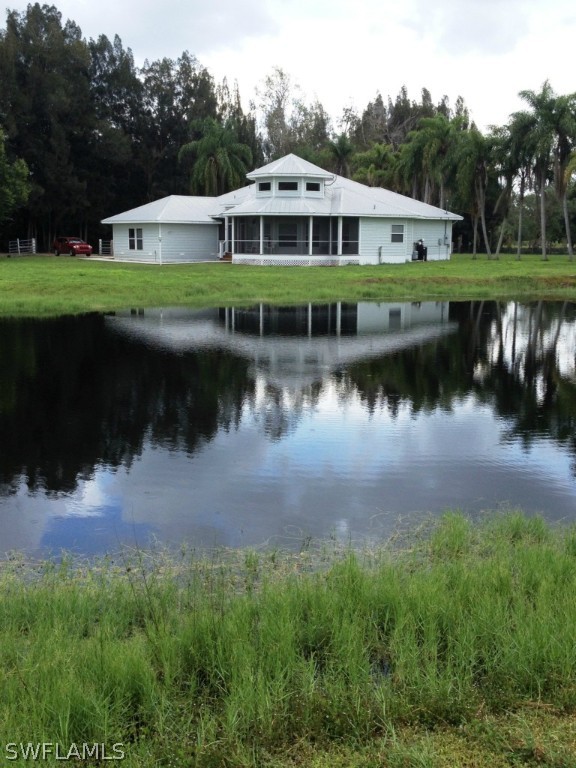 10220 Deal Road North Fort Myers, FL 33917 - Photo 3 of 21 a front view of a house with a yard