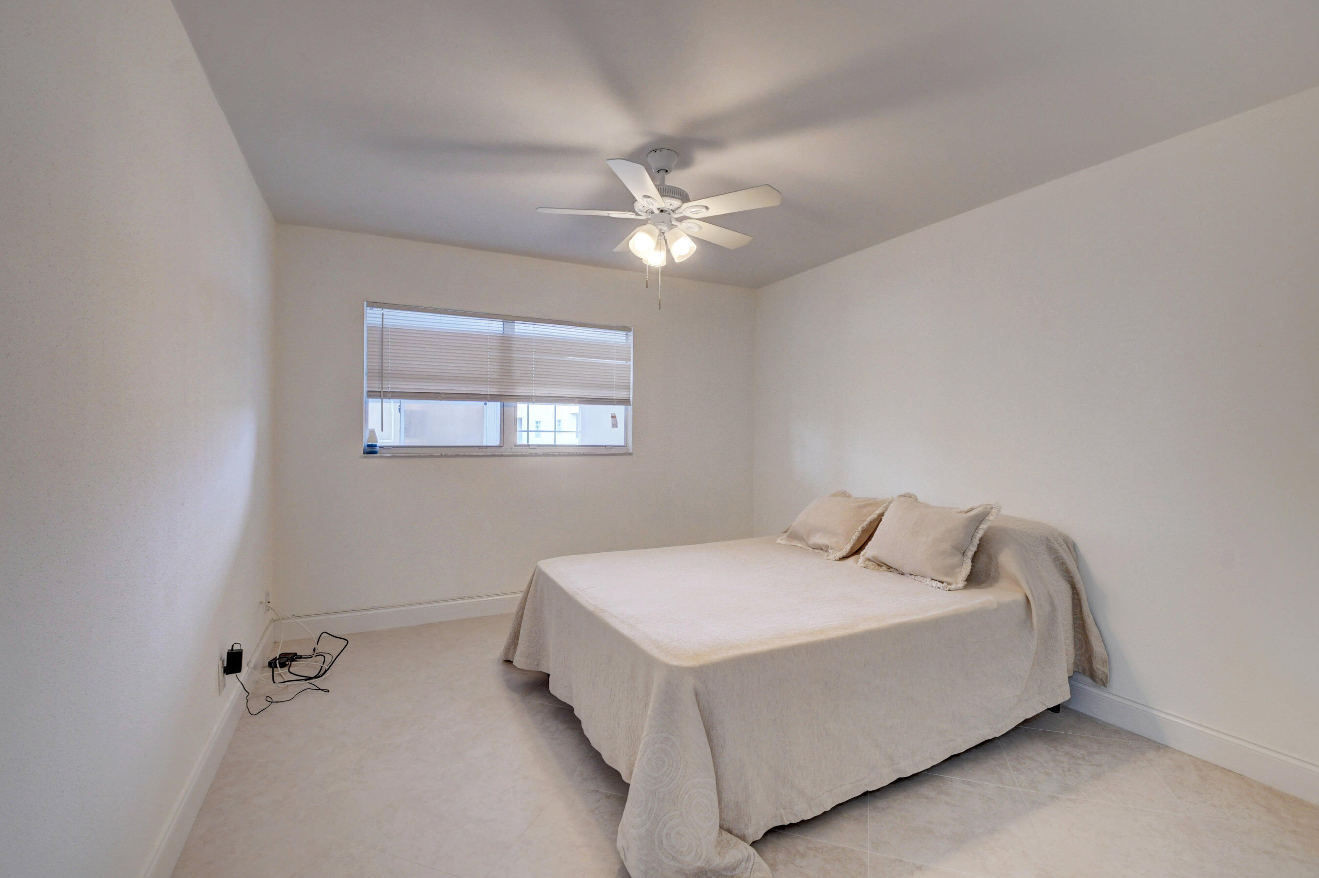 468 Saxony Way Delray Beach, FL 33446 - Photo 9 of 14 a bedroom with a bed and a ceiling fan