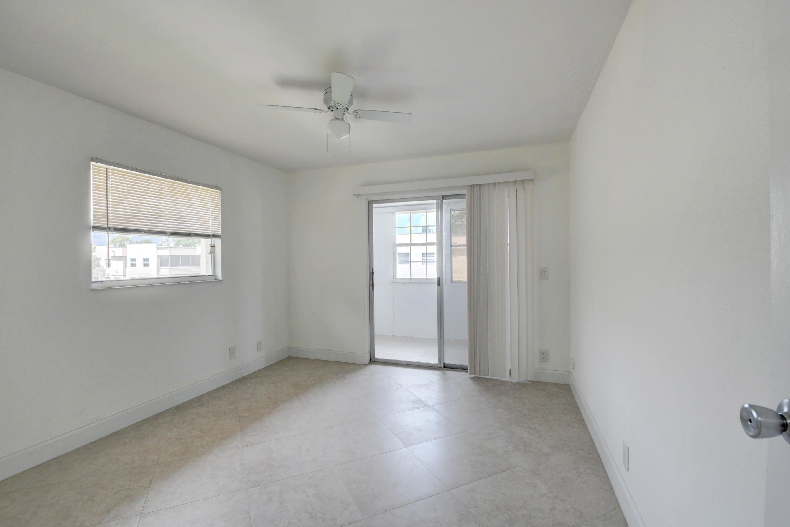 468 Saxony Way Delray Beach, FL 33446 - Photo 10 of 14 a view of an empty room with a window