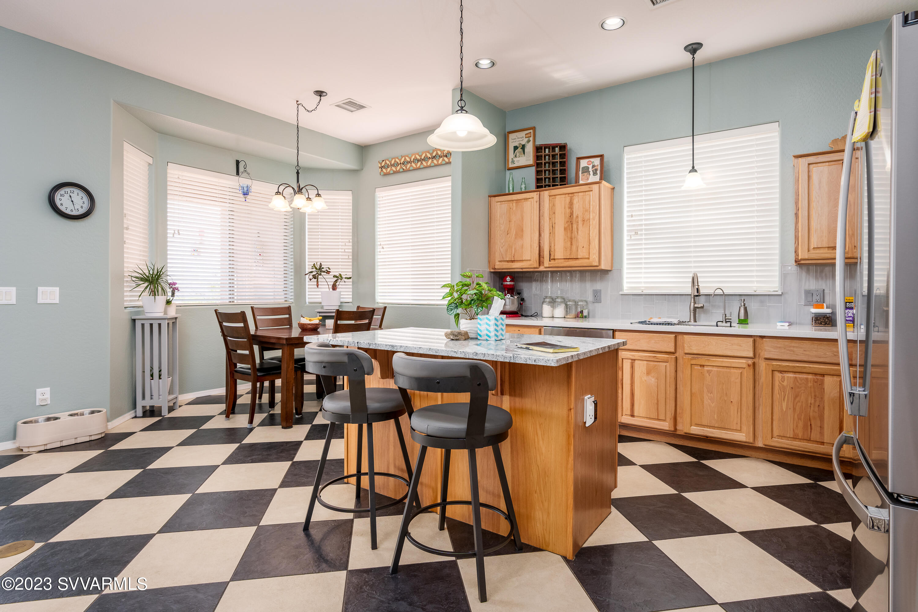 856 West Deep Gorge Road Camp Verde, AZ 86322 - Photo 14 of 31 a kitchen with a sink a counter and dining table chair