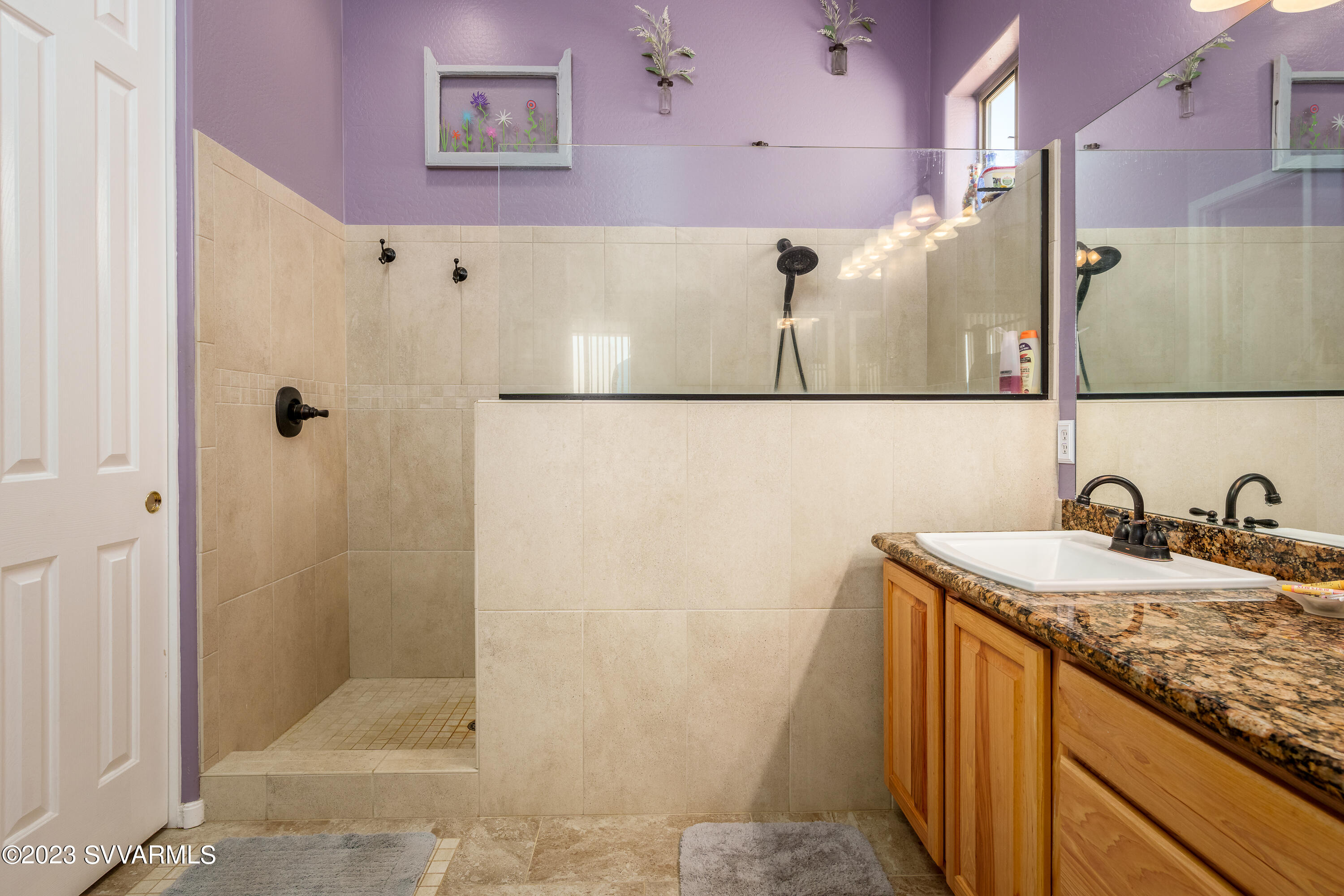 856 West Deep Gorge Road Camp Verde, AZ 86322 - Photo 21 of 31 a bathroom with a granite countertop sink a mirror and shower