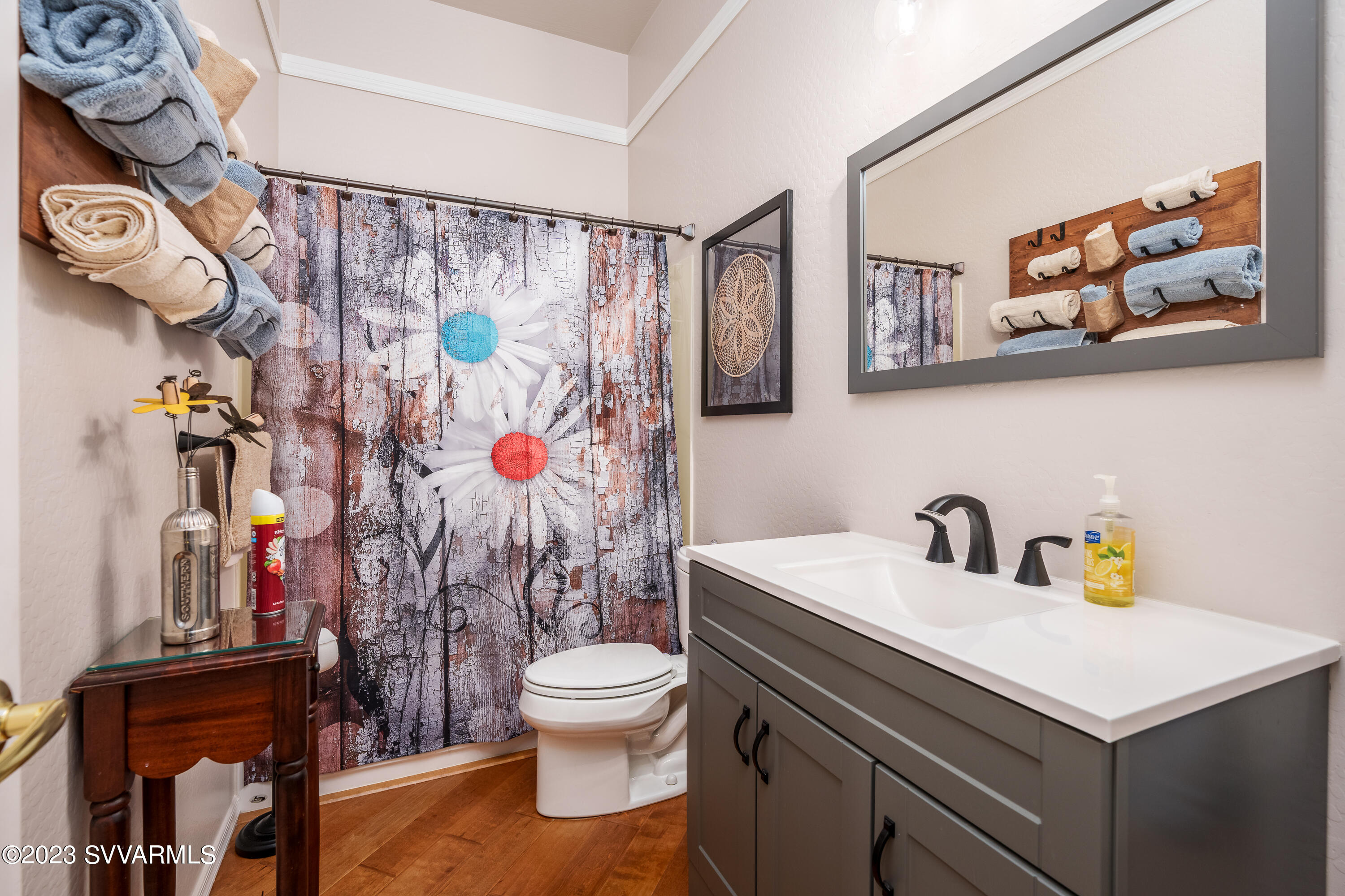 856 West Deep Gorge Road Camp Verde, AZ 86322 - Photo 23 of 31 a bathroom with a sink a toilet and shower curtain