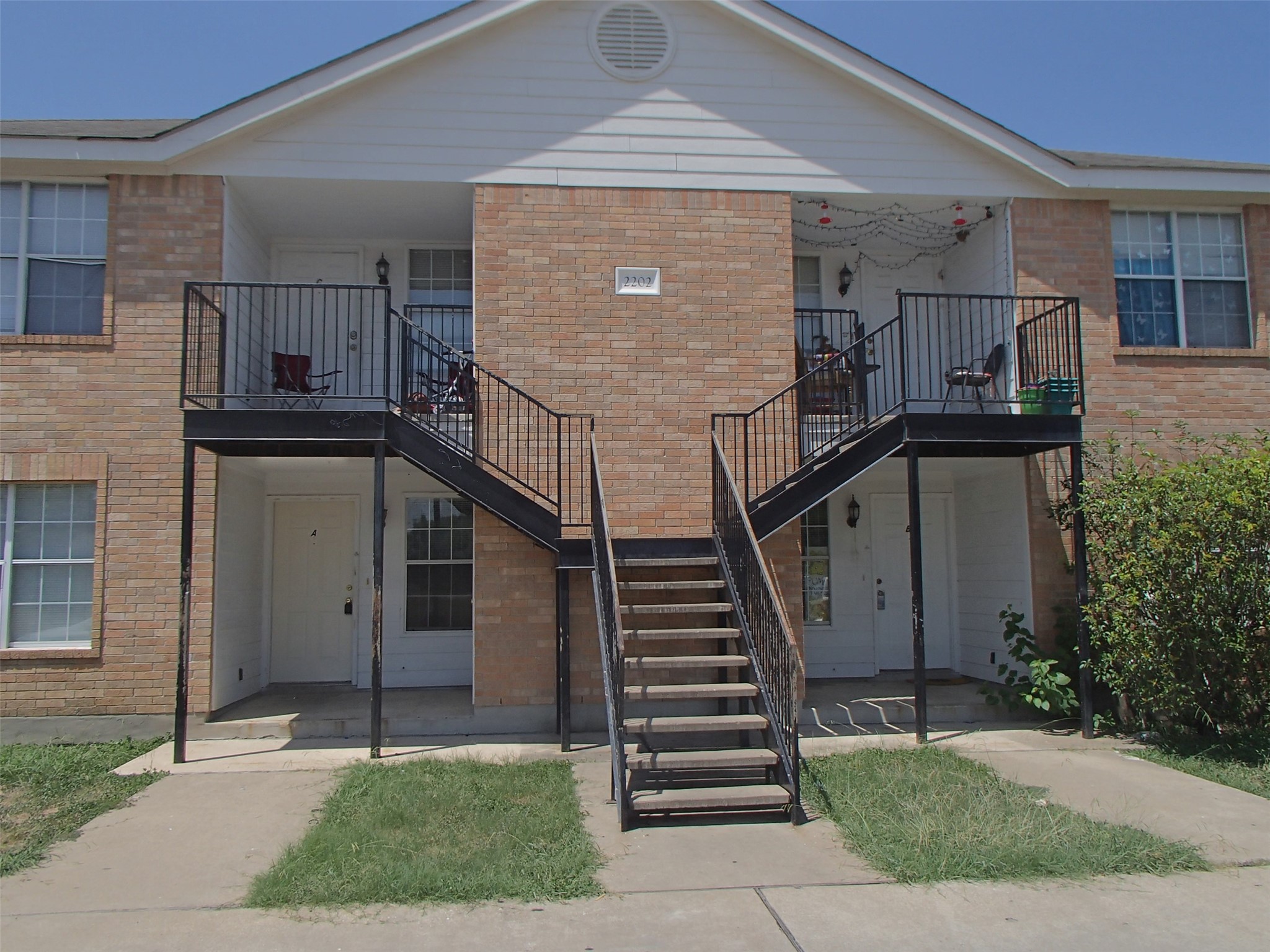 View of property featuring stairs