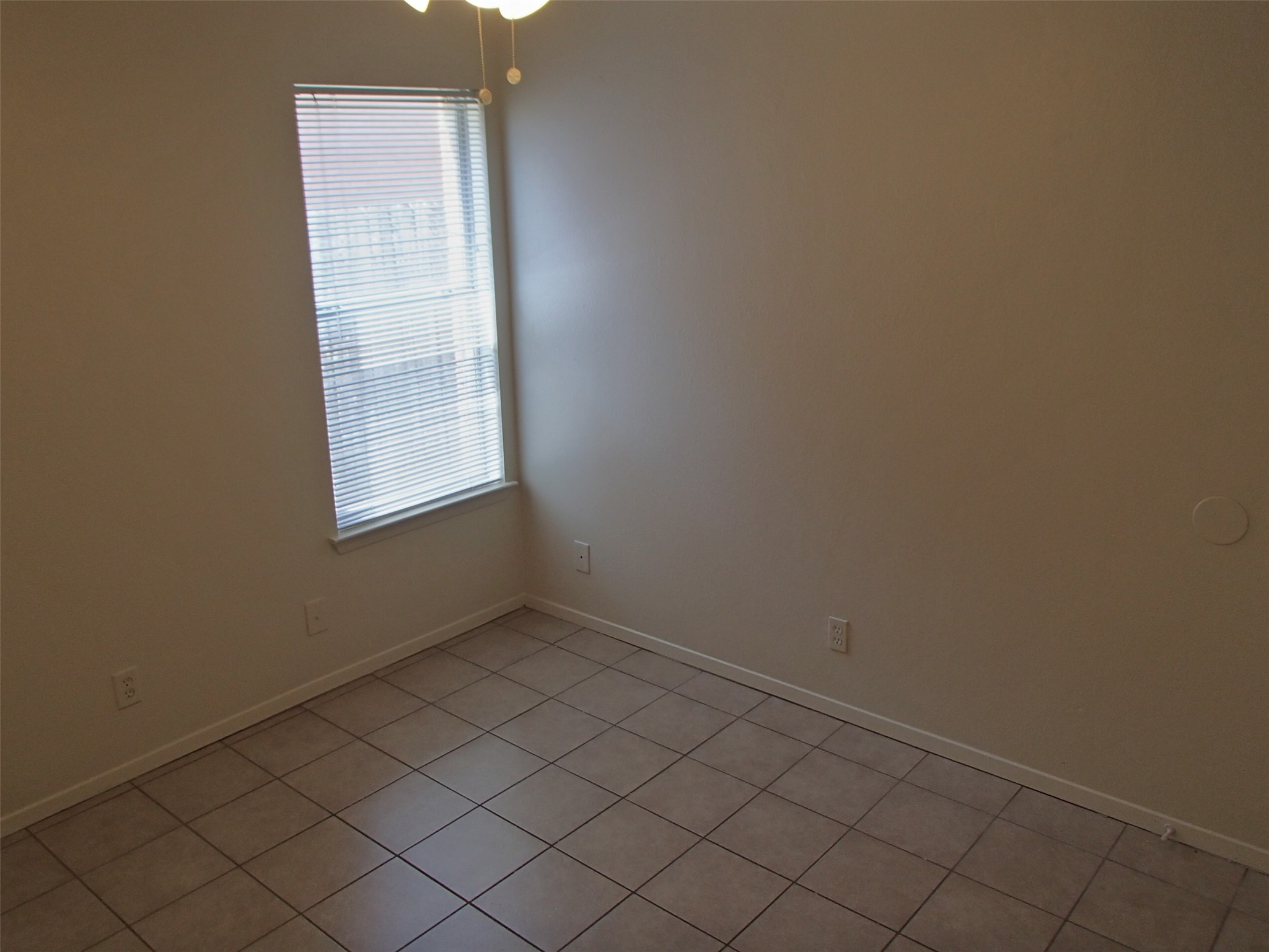2202 Katy Lane, Unit A Georgetown, TX 78626 - Photo 4 of 9 Unfurnished room featuring light tile patterned floors