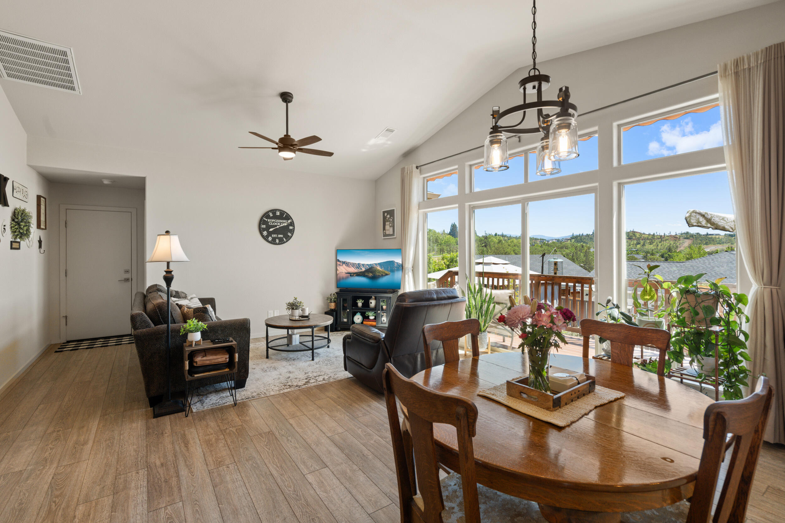 1008 Azure Way Eagle Point, OR 97524 - Photo 11 of 59 a view of a dining room with furniture window and wooden floor