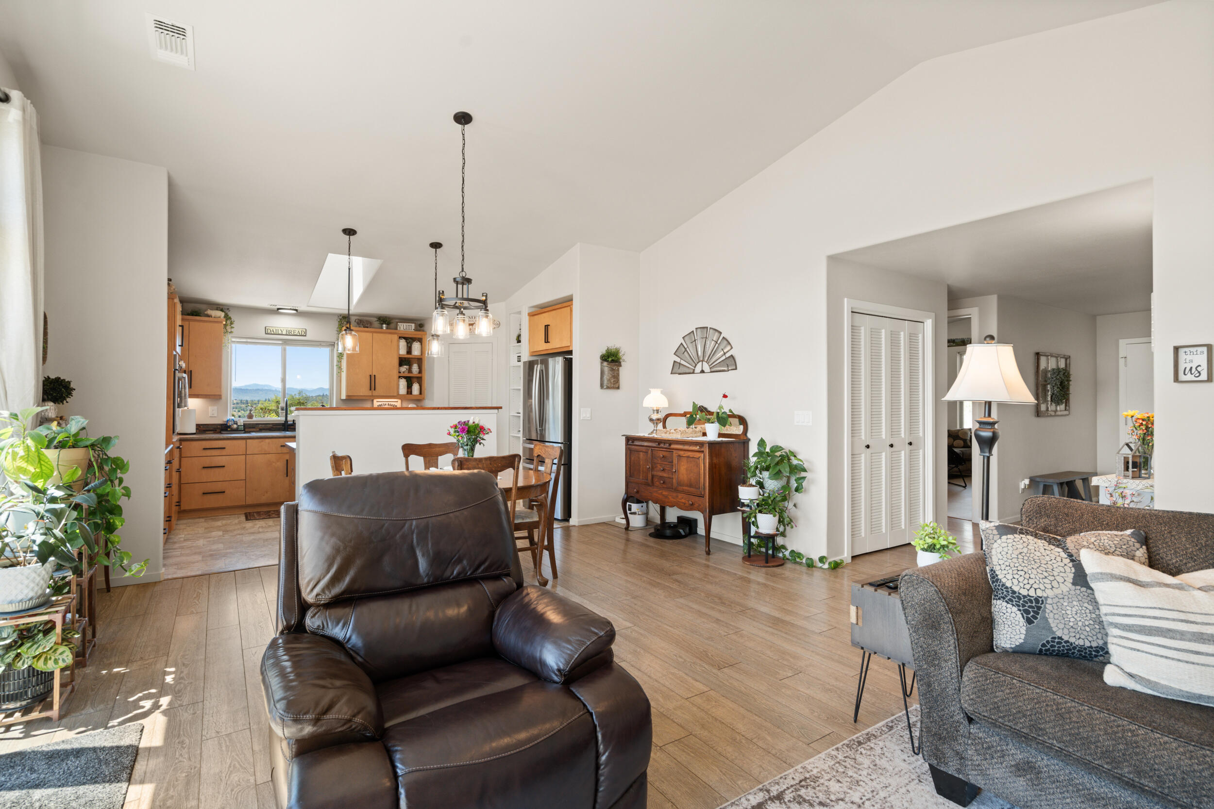 1008 Azure Way Eagle Point, OR 97524 - Photo 13 of 59 a living room with furniture and a chandelier